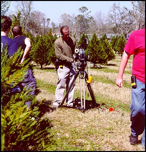 Camera Man Makes Adjustments