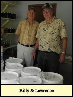 Billy & Lawrence in honey processing building.