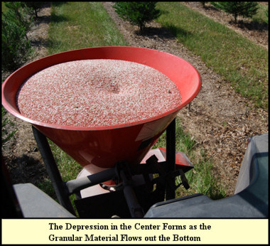 Granular fertilizer in cyclone hopper.